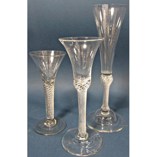 116 - A tall Georgian fluted Champagne glass with a spiral stem, a waisted bucket wine glass with spiral s... 