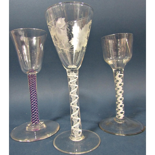 121 - Two Georgian  conical grape and vine engraved wine glasses with double spiral and helix air blown st... 