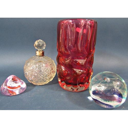 125 - Twelve Caithness paperweights of varying shapes and sizes, a red glass vase and a cut glass scent bo... 