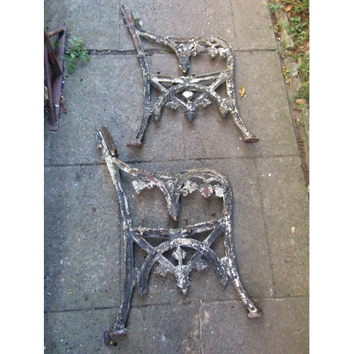 1001 - A pair of 19th century cast iron bench ends with decorative pierced floral gothic pattern (af)