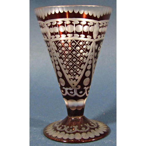 135 - Six red engraved conical shaped liqueur glasses.