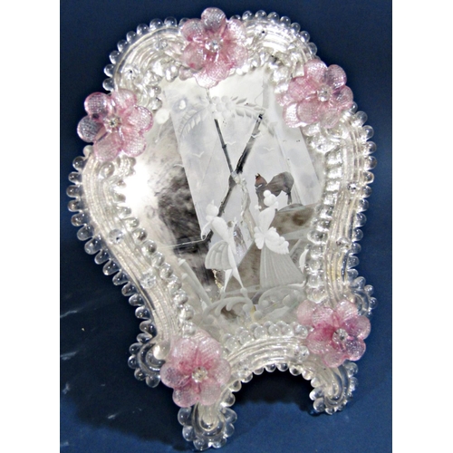 136 - A Venetian glass toilet mirror with pink petal detail to beaded and scrolled glass frame enclosing e... 