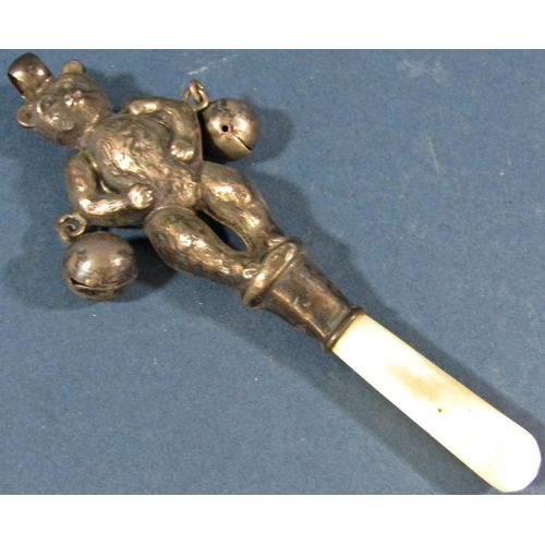 186 - A silver babies rattle in the form of a teddy bear with a mother of pearl teether, Birmingham 1920, ... 