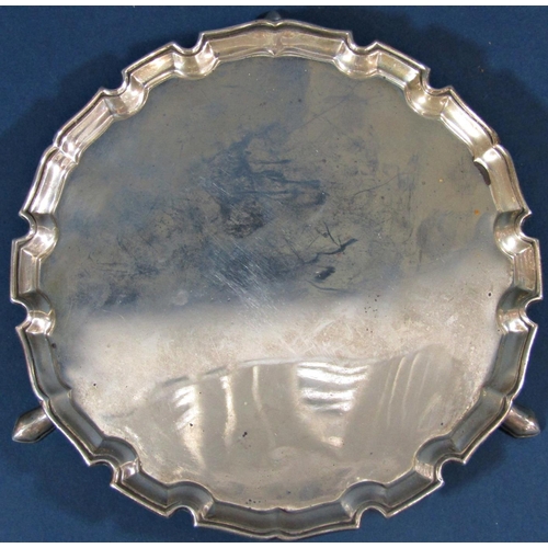 189 - A small silver tray with shaped edge, raised on three pad feet, London 1930, maker Ernest J Lowe, 15... 