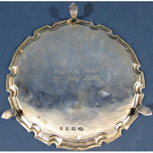 189 - A small silver tray with shaped edge, raised on three pad feet, London 1930, maker Ernest J Lowe, 15... 