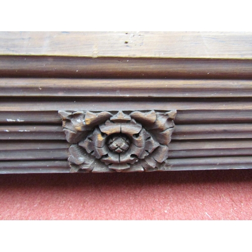 1115 - 19th century or earlier carved pine lintel or mantlepiece with repeating floral panels, 175cm long