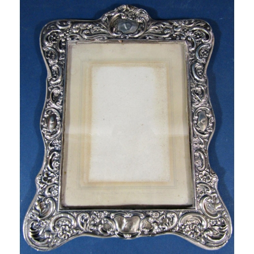 203 - An Edwardian silver foliate vase embossed photo frame, Chester 1906, maker unknown, 30 x 23cm approx... 