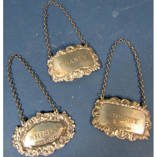 211 - Three silver drinks labels, Sherry, Whiskey, Brandy, two hallmarked and one stamped sterling 925, 1.... 