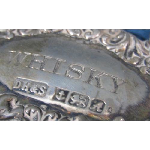 211 - Three silver drinks labels, Sherry, Whiskey, Brandy, two hallmarked and one stamped sterling 925, 1.... 