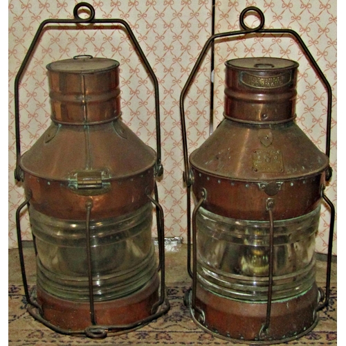 1133 - A pair of copper marine lanterns by Seahorse, anchor and not under command, numbers 26351 and 26559