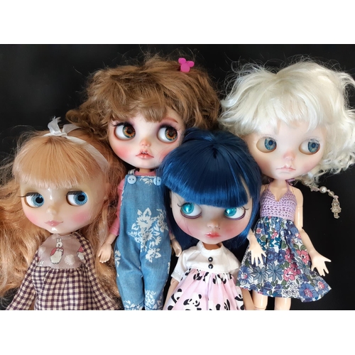 584 - A mixed group of seven 21st century customised Blythe type dolls; all have colour changing eyes oper... 