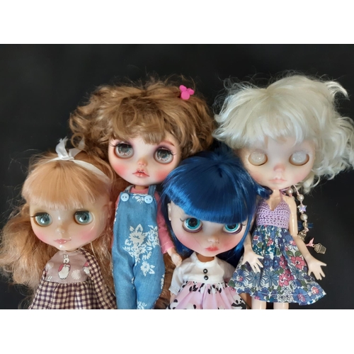 584 - A mixed group of seven 21st century customised Blythe type dolls; all have colour changing eyes oper... 