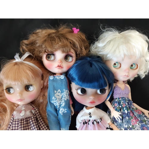 584 - A mixed group of seven 21st century customised Blythe type dolls; all have colour changing eyes oper... 