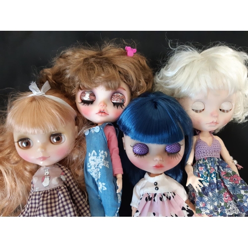 584 - A mixed group of seven 21st century customised Blythe type dolls; all have colour changing eyes oper... 