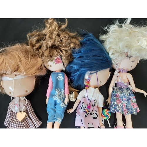 584 - A mixed group of seven 21st century customised Blythe type dolls; all have colour changing eyes oper... 