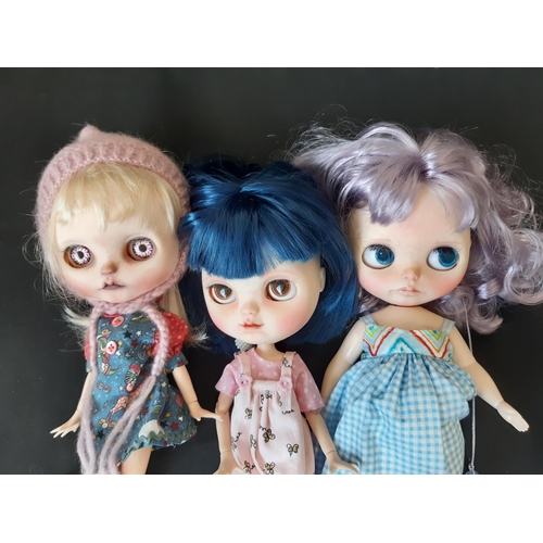 584 - A mixed group of seven 21st century customised Blythe type dolls; all have colour changing eyes oper... 