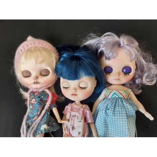 584 - A mixed group of seven 21st century customised Blythe type dolls; all have colour changing eyes oper... 