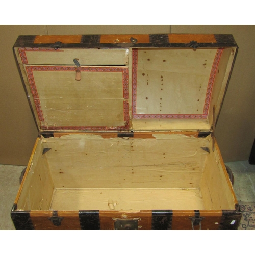 1168 - A 19th century timber lathe bound and steel banded domed topped travelling trunk with stitched leath... 