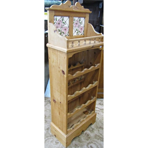 1195 - A stripped pine kitchen floorstanding wine rack to hold sixteen bottles, with galleried shelf and de... 