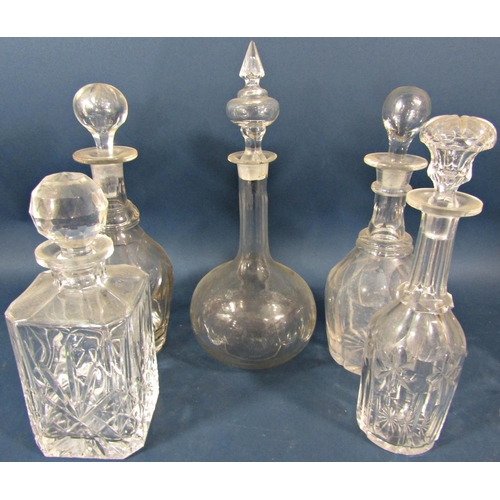 139 - Five 19th century glass decanters of varying design, all complete with the original stopper.