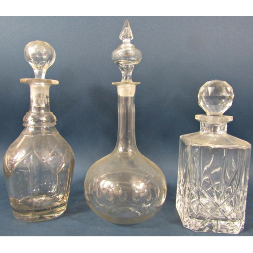 139 - Five 19th century glass decanters of varying design, all complete with the original stopper.