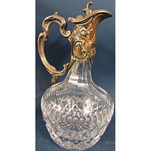 140 - An early 20th century engraved glass claret jug with a silver plated collar and handle, 27cm high, a... 