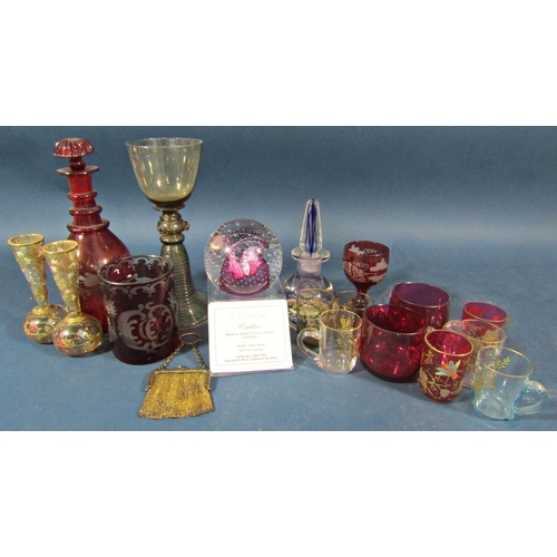 141 - A mixed selection of glass ware including an amber wine glass on a coiled foot, a Bohemian red glass... 