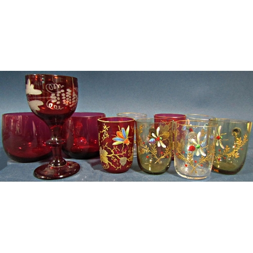 141 - A mixed selection of glass ware including an amber wine glass on a coiled foot, a Bohemian red glass... 