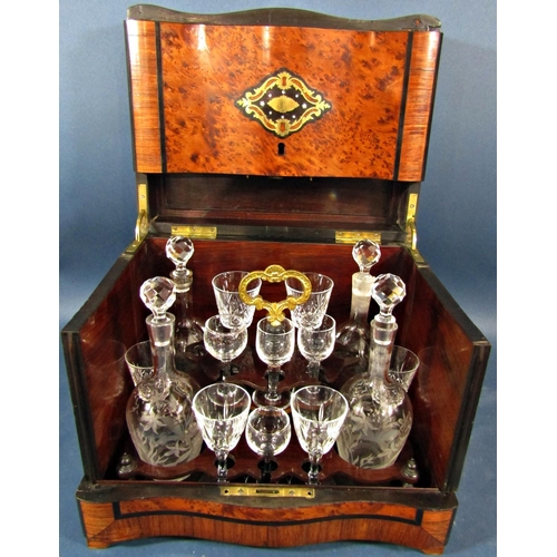 146 - A Victorian burr walnut travelling drinks cabinet with four floral etched glass decanters, six small... 