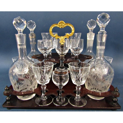 146 - A Victorian burr walnut travelling drinks cabinet with four floral etched glass decanters, six small... 