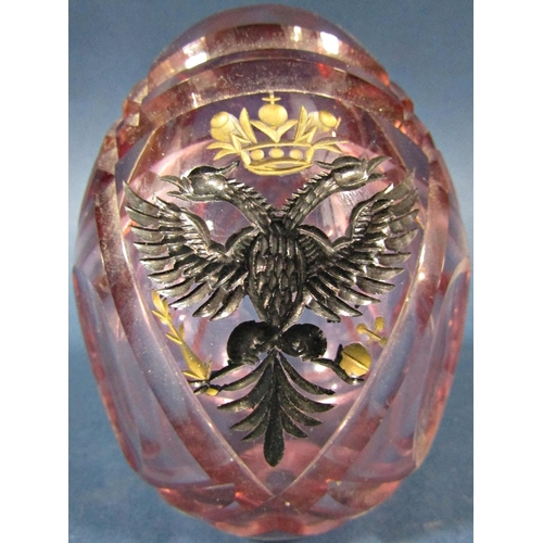 148 - A single pale pink cut glass Faberge style Easter egg bearing a Black Russian Imperial doodle headed... 