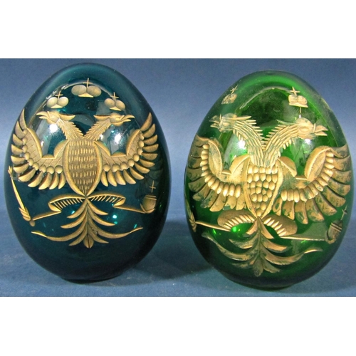 149 - Two green cut glass gilded Faberge style Easter eggs, bearing the Russian Imperial double headed eag... 