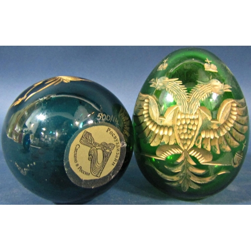 149 - Two green cut glass gilded Faberge style Easter eggs, bearing the Russian Imperial double headed eag... 