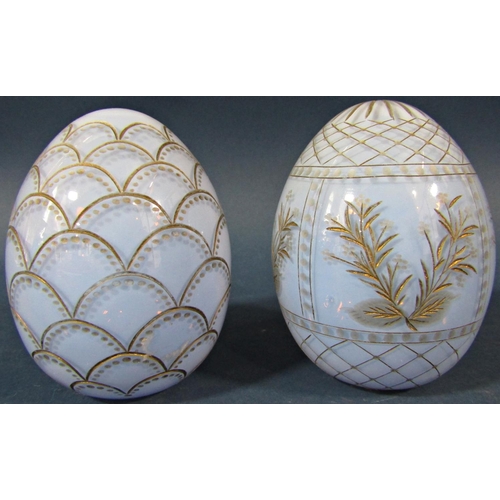 152 - A pale blue cut glass and gilded Faberge style Easter egg with fish scale design and another pale bl... 