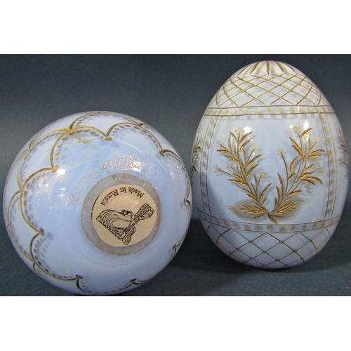 152 - A pale blue cut glass and gilded Faberge style Easter egg with fish scale design and another pale bl... 