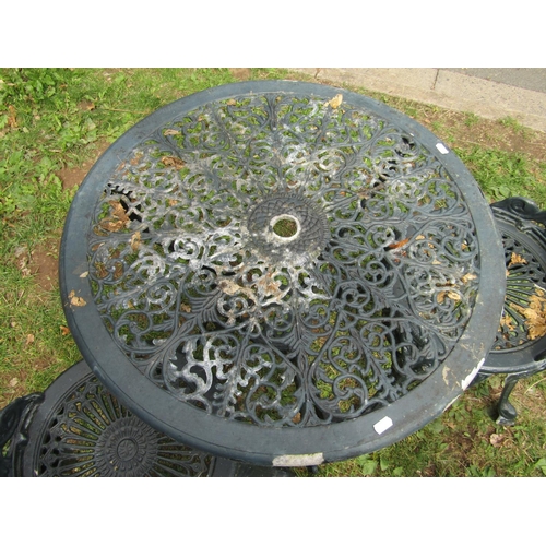1005 - A dark green painted cast aluminium garden terrace table of circular form with decorative pierced to... 