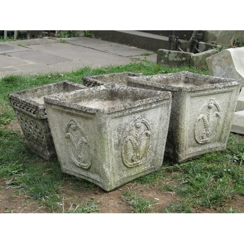 1011 - A pair of weathered cast composition stone planters of square tapered form with repeating fleur-de-l... 