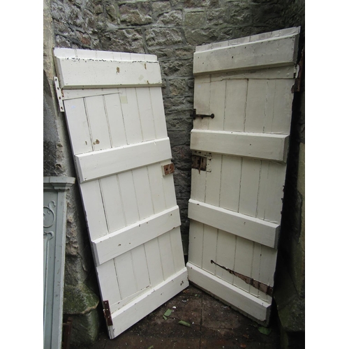1029 - Five reclaimed antique painted legged and braced internal pine doors, some complete with fittings, o... 