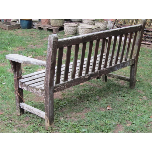 1055 - A Barlow Tyrie weathered teak garden bench with slatted seat and back 160 cm wide
