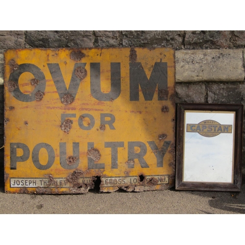 1085 - A vintage enamel sign of rectangular form advertising Ovum For Poultry, yellow ground with black let... 