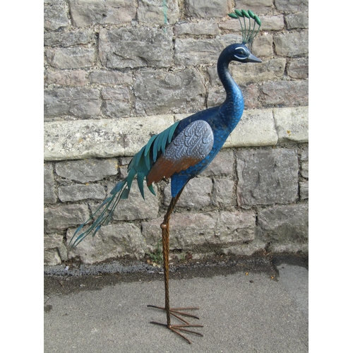 1090 - A decorative contemporary garden/interior ornament in the form of a peacock, of moulded sheet metal ... 