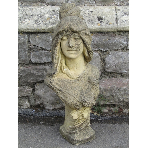 1097 - A weathered buff coloured head and shoulder bust of an art nouveau style maiden, 65cm high