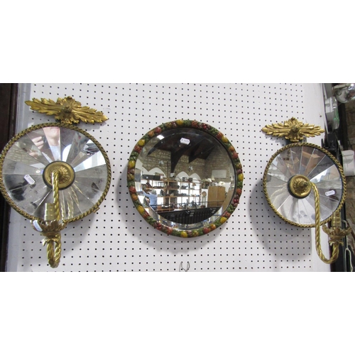 652 - A pair of Regency style  electric light wall sconces with a scrolled arm centred to segmented concav... 