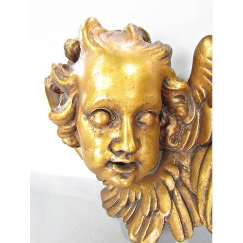 653 - An Angel’s face, terracotta with a gold finish.