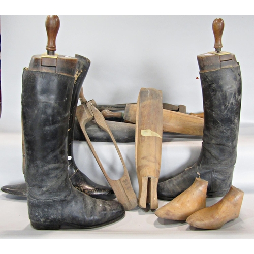 660 - A pair of vintage black riding boots with wooden trees and an assortment of other boot trees, (as fo... 