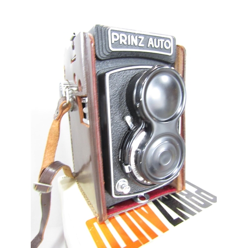 661 - Photographic equipment consisting of a Prinz Auto semi automatic 2 1/4 square precision twin-lens re... 