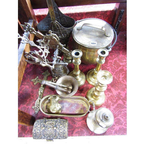 664 - Assorted brass ware consisting of coal bucket, candlesticks, pestle and mortars, a decorative wall h... 