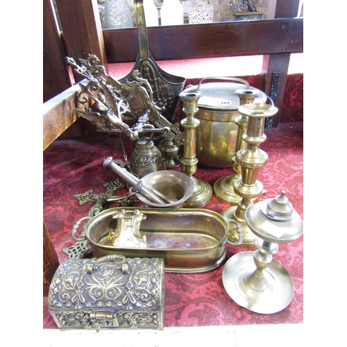 664 - Assorted brass ware consisting of coal bucket, candlesticks, pestle and mortars, a decorative wall h... 