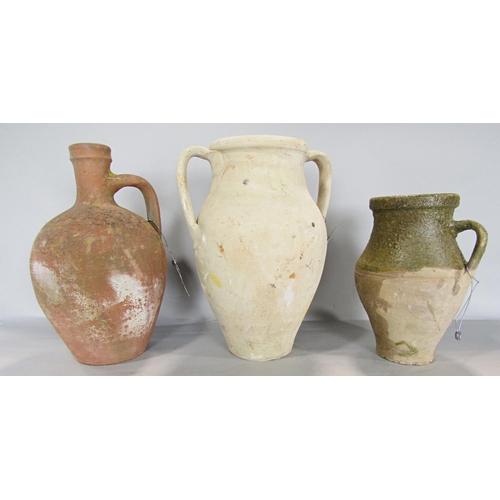 665 - An earthenware flagon, a double handled vase, and a partially glazed earthenware vase.