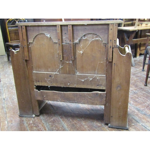 1628 - An arts and crafts oak hall bench with box seat, panelled back and pierced sides supporting two open... 